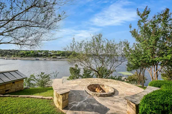 a view of a lake with a yard