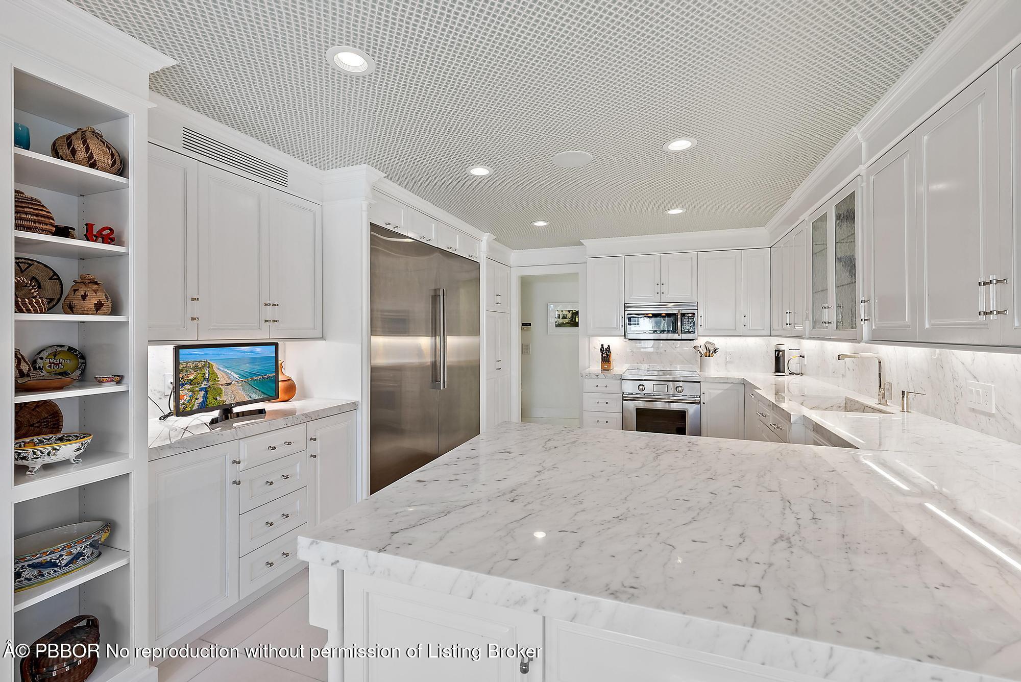 44 Cocoanut Row, Unit 310B Palm Beach, FL 33480 - Photo 11 of 30 a large kitchen with cabinets