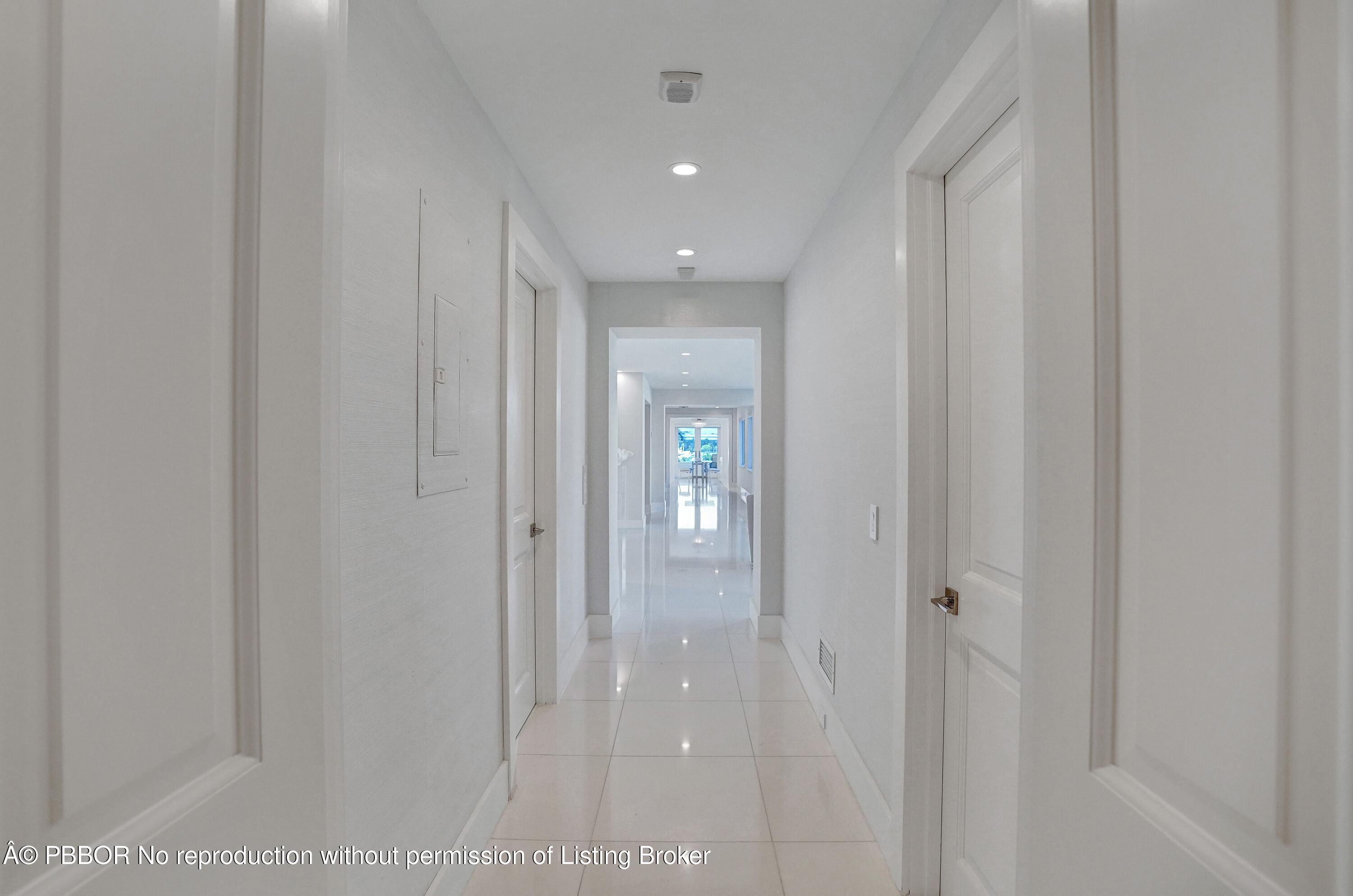 44 Cocoanut Row, Unit 310B Palm Beach, FL 33480 - Photo 13 of 30 a view of a hallway with wooden shelves