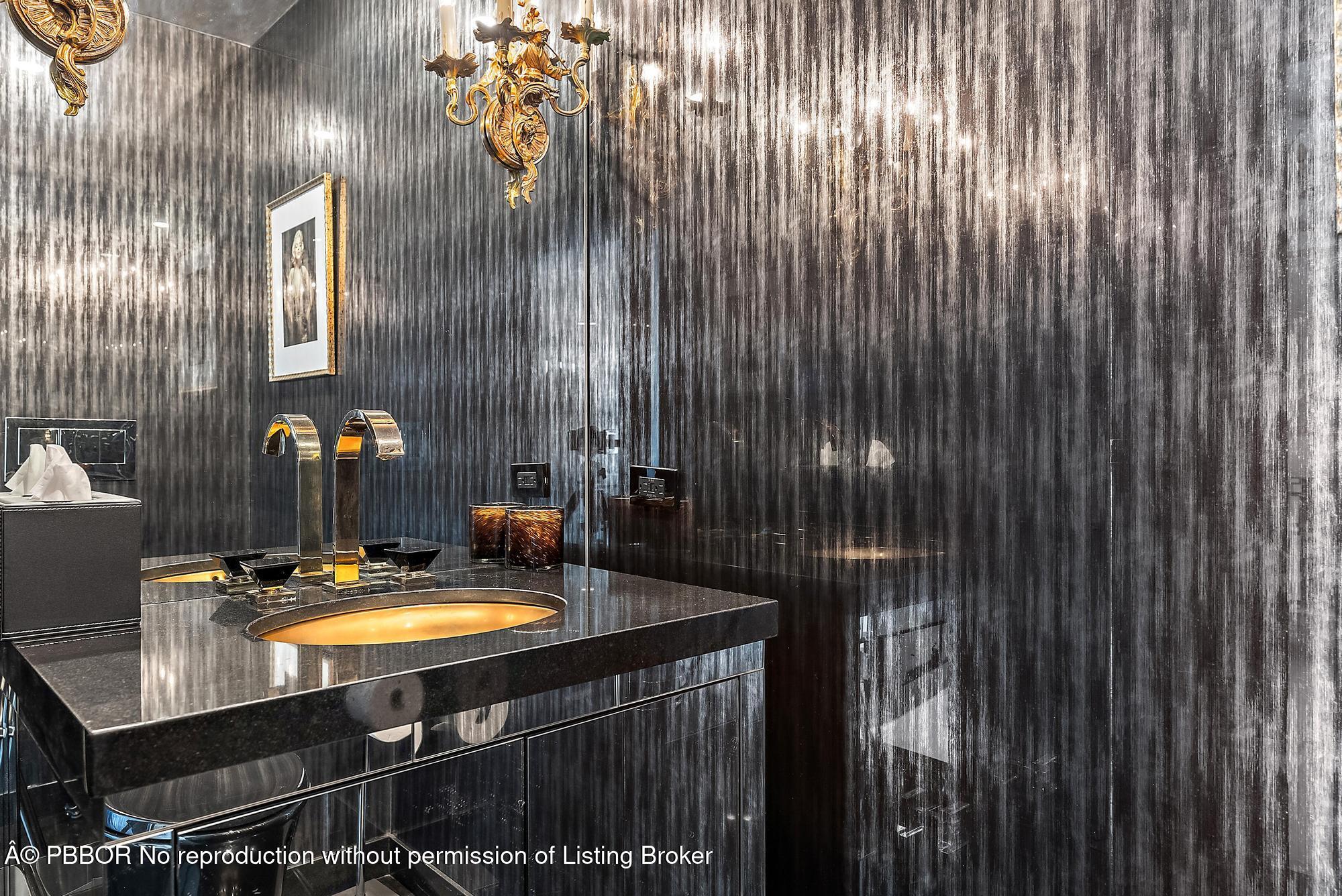 44 Cocoanut Row, Unit 310B Palm Beach, FL 33480 - Photo 14 of 30 a bathroom with a sink vanity and mirror