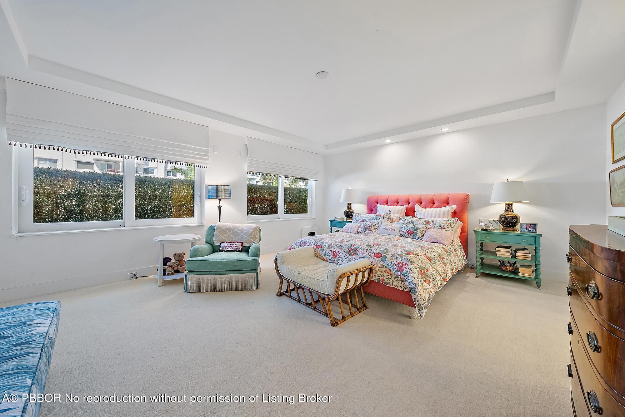 44 Cocoanut Row, Unit 310B Palm Beach, FL 33480 - Photo 15 of 30 a spacious bedroom with a bed and a window