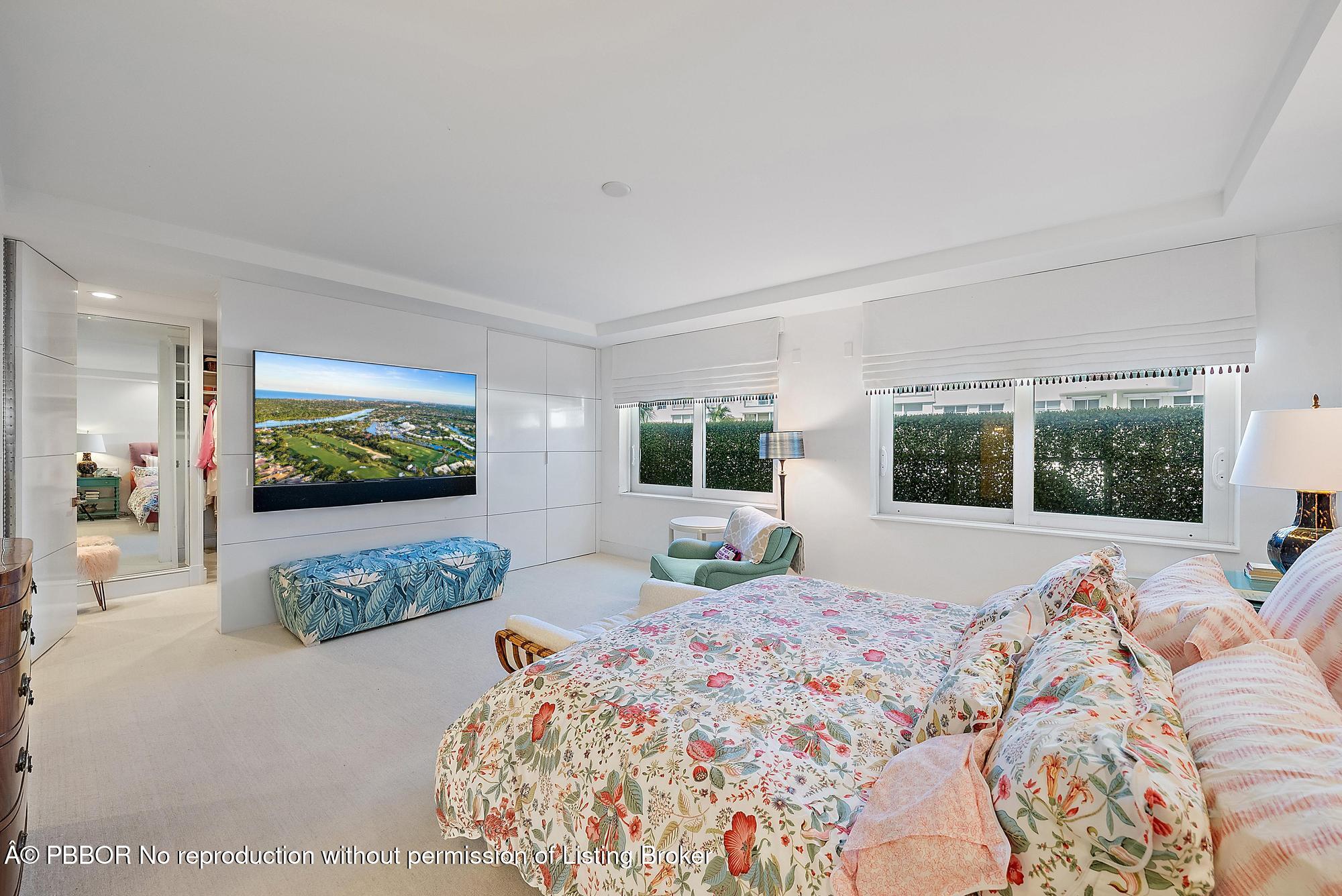 44 Cocoanut Row, Unit 310B Palm Beach, FL 33480 - Photo 16 of 30 a bedroom with a bed and large windows