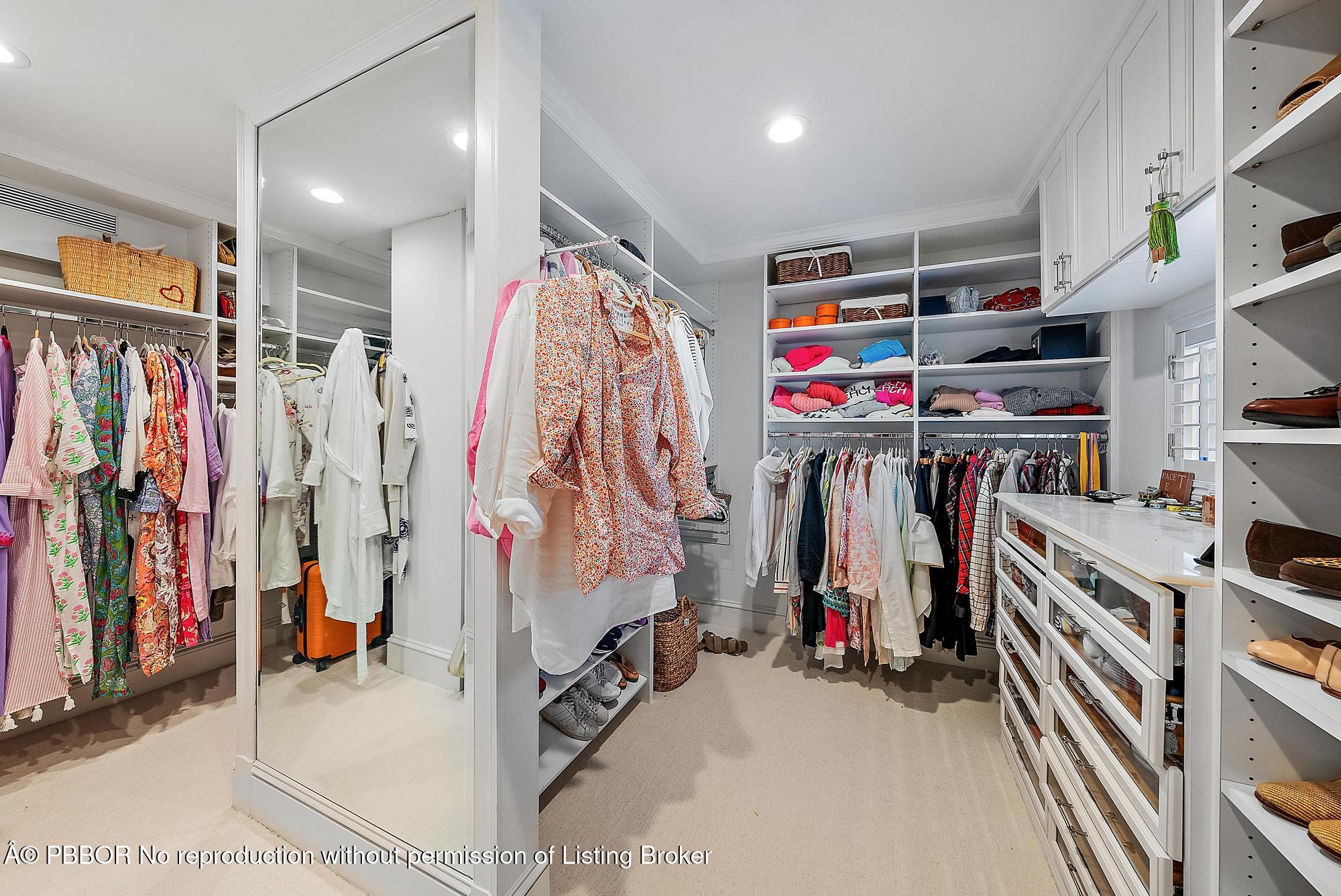 44 Cocoanut Row, Unit 310B Palm Beach, FL 33480 - Photo 17 of 30 a view of walk in closet with clothes and shoes