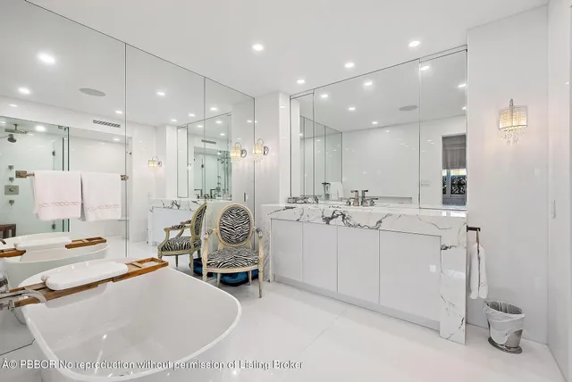 a large room with a lot of white furniture