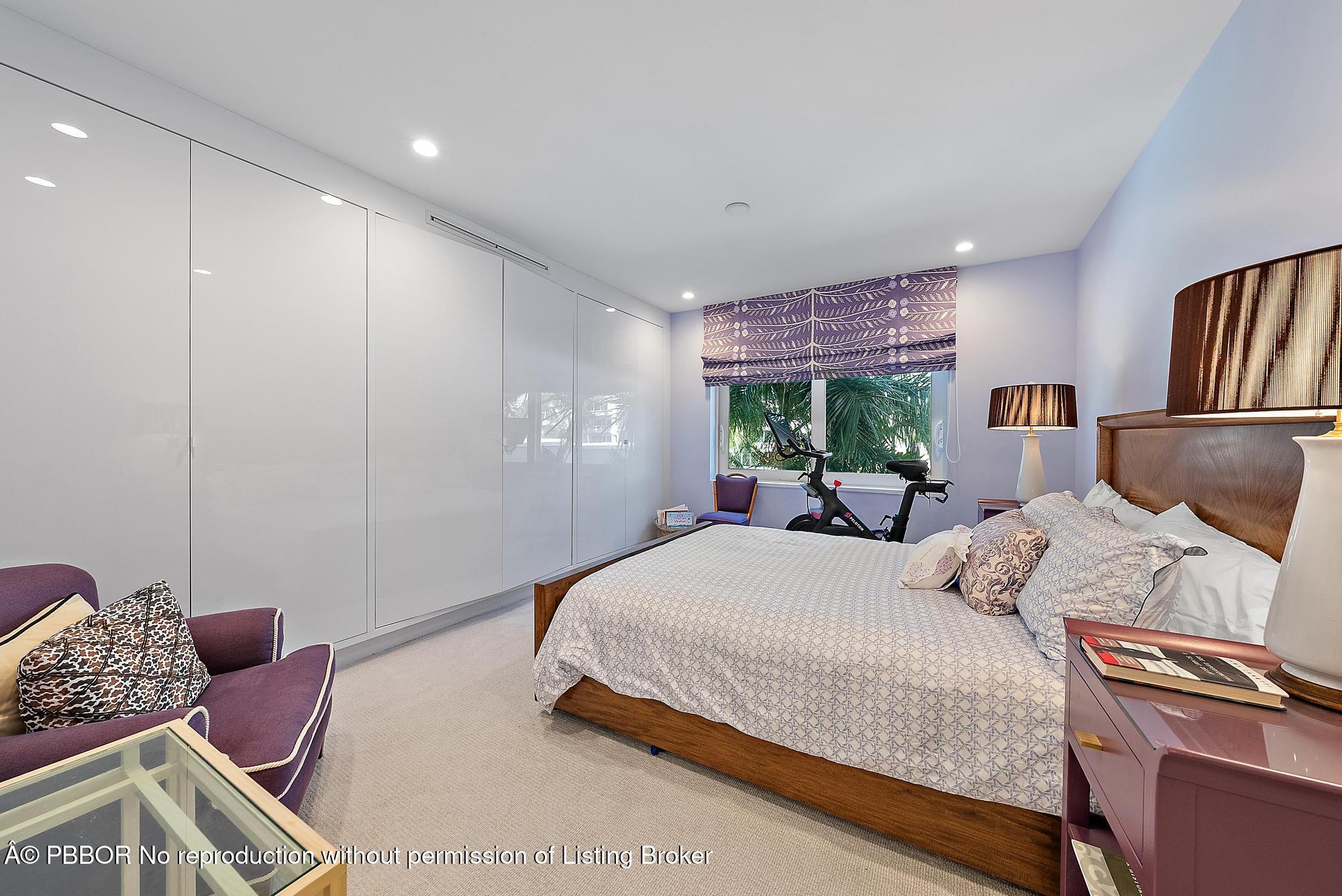 44 Cocoanut Row, Unit 310B Palm Beach, FL 33480 - Photo 23 of 30 a bedroom with a bed and wooden floor