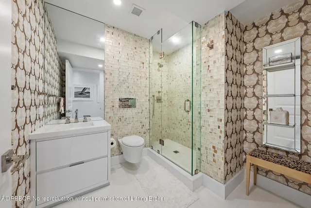 a bathroom with a sink toilet and shower