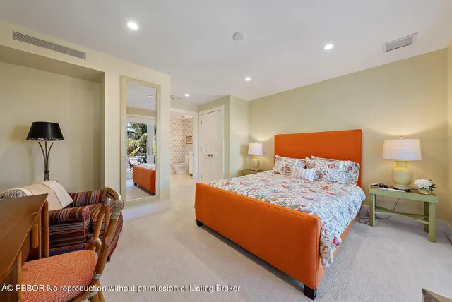 a bedroom with a bed and a couch