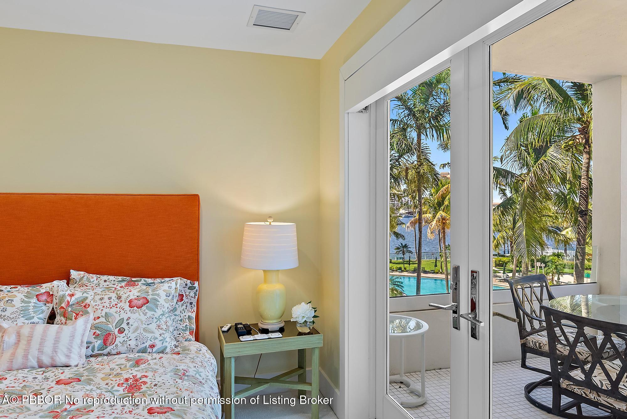 44 Cocoanut Row, Unit 310B Palm Beach, FL 33480 - Photo 27 of 30 a bedroom with a bed and a window