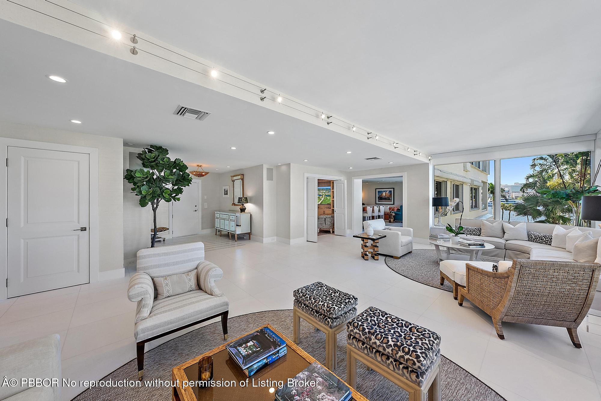 44 Cocoanut Row, Unit 310B Palm Beach, FL 33480 - Photo 4 of 30 a living room with furniture and a potted plant