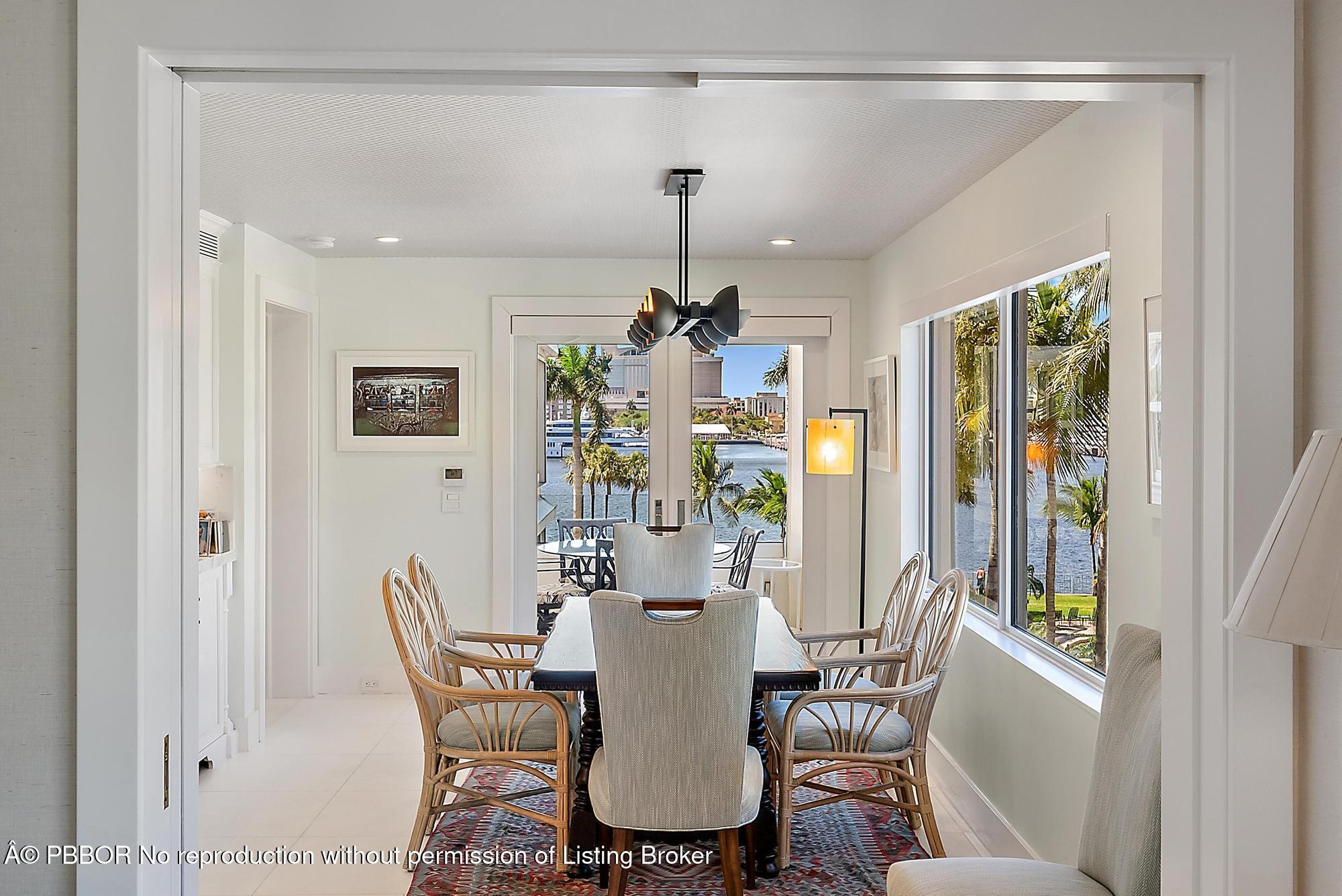44 Cocoanut Row, Unit 310B Palm Beach, FL 33480 - Photo 10 of 30 a dining room with furniture a chandelier and window