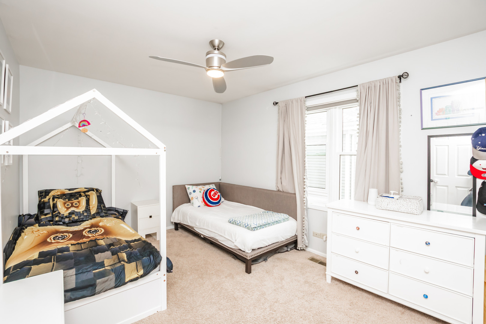 1139 West Roscoe Street Chicago, IL 60657 - Photo 12 of 28 a bedroom with furniture and a large window