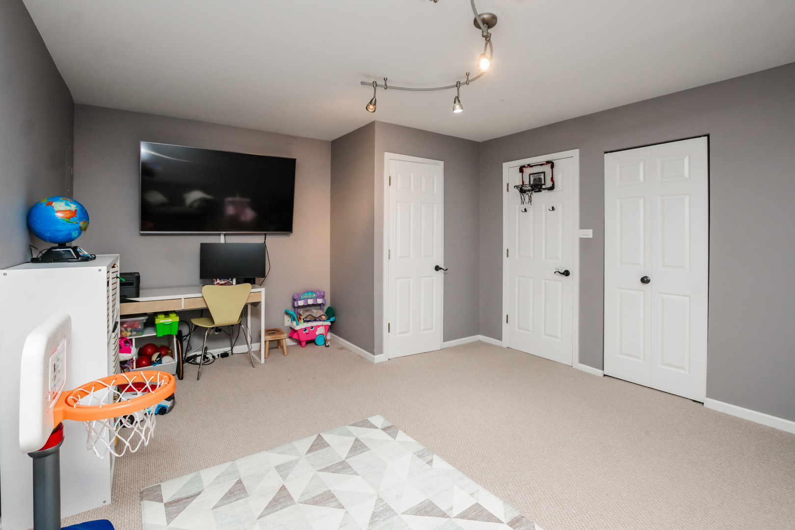 1139 West Roscoe Street Chicago, IL 60657 - Photo 15 of 28 a view of a livingroom with baby furniture and a flat screen tv