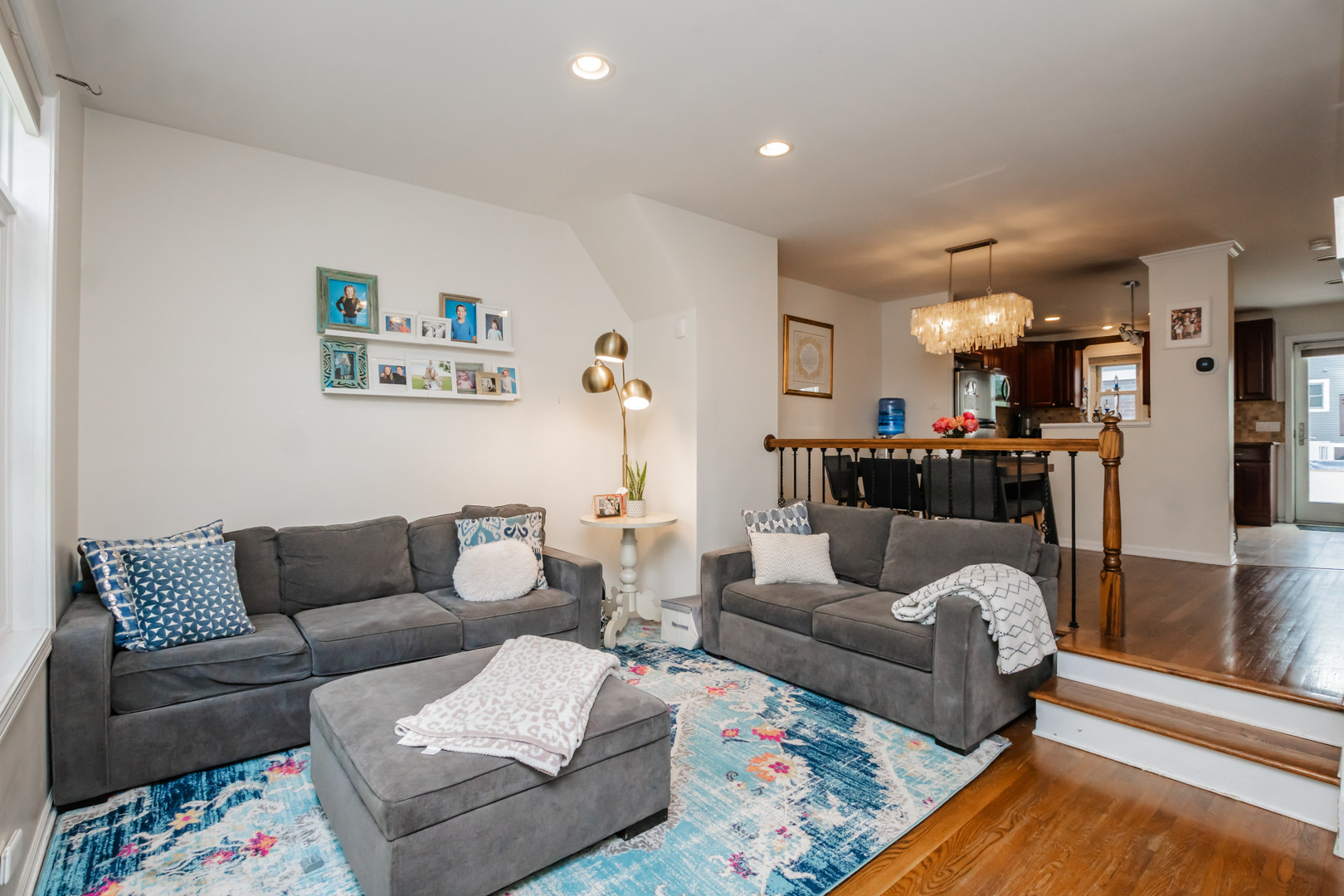 1139 West Roscoe Street Chicago, IL 60657 - Photo 2 of 28 a living room with furniture and a couch