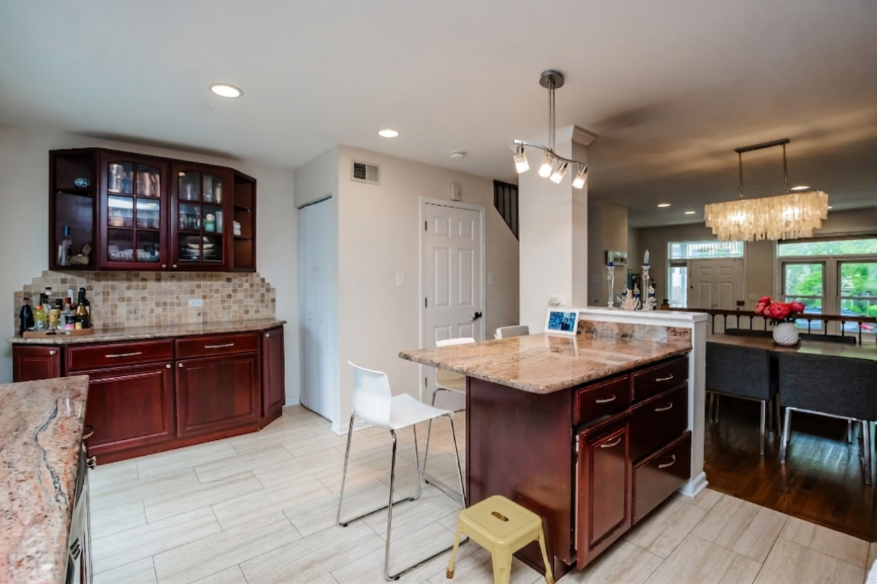 1139 West Roscoe Street Chicago, IL 60657 - Photo 9 of 28 a kitchen with a stove and a refrigerator