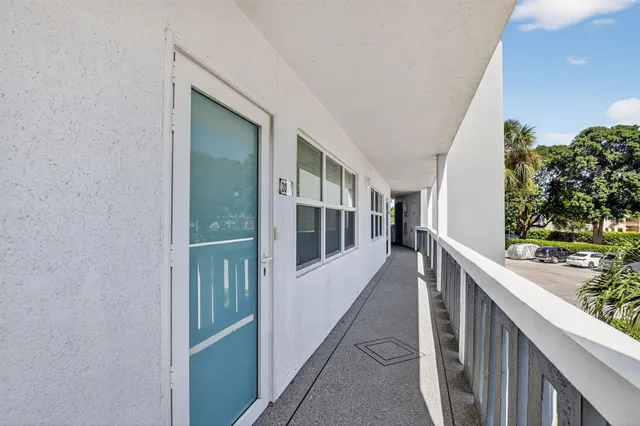 an aerial view of a residential houses with outdoor space