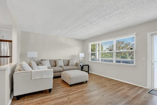 a view of a park with swings and slides