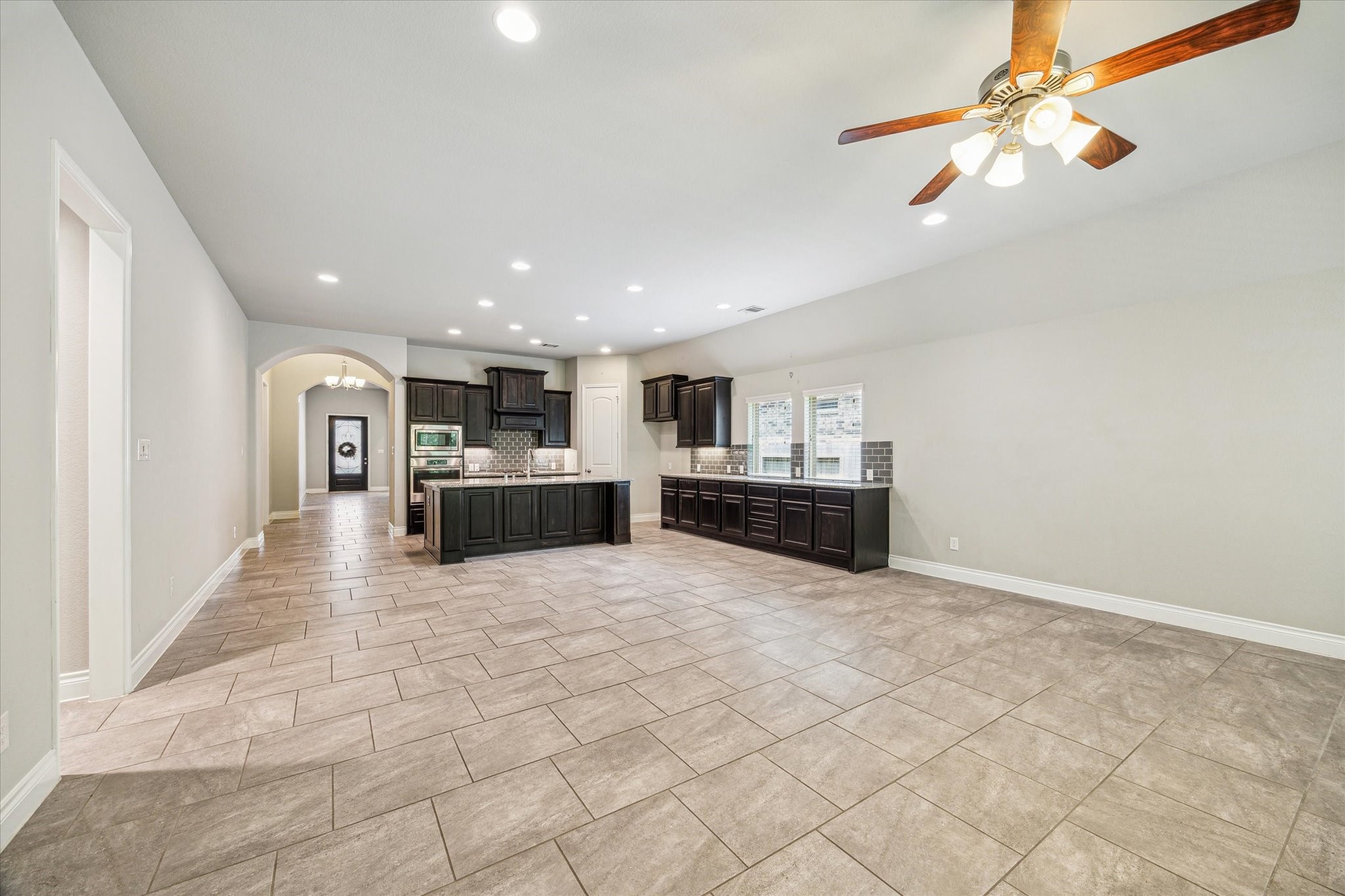 253 Trillium Park Loop Conroe, TX 77304 - Photo 14 of 37 a view of kitchen with refrigerator and window