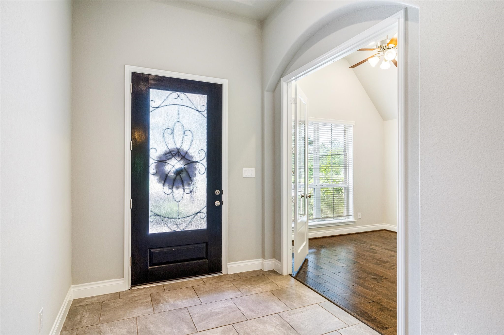 253 Trillium Park Loop Conroe, TX 77304 - Photo 16 of 37 a view of a hallway with wooden floor and windows