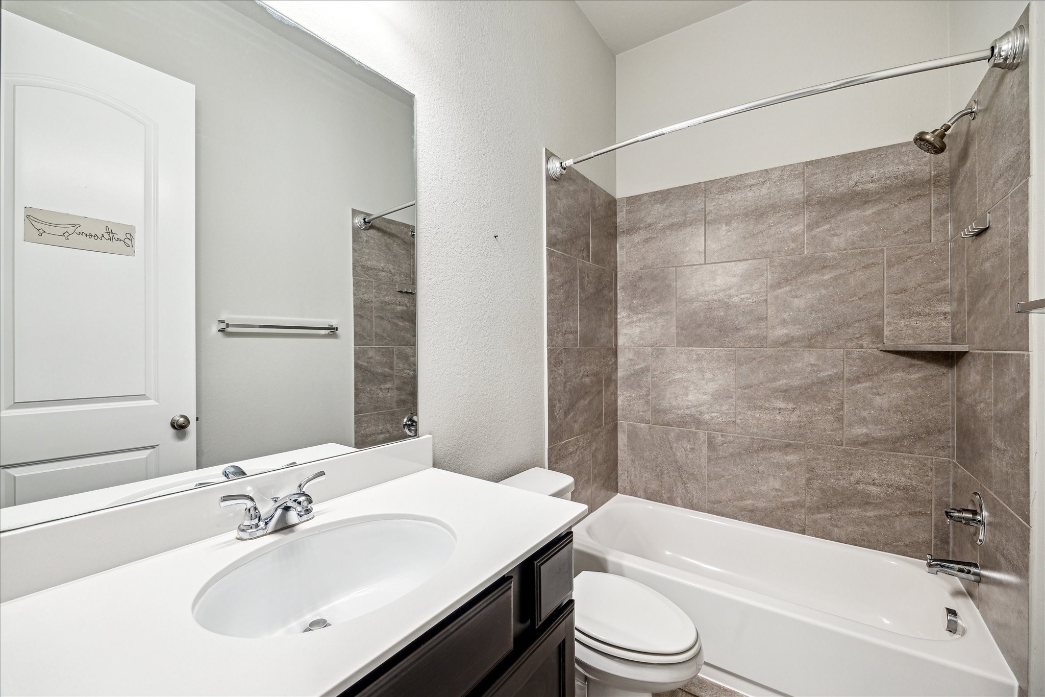 253 Trillium Park Loop Conroe, TX 77304 - Photo 28 of 37 a bathroom with a sink a toilet and shower