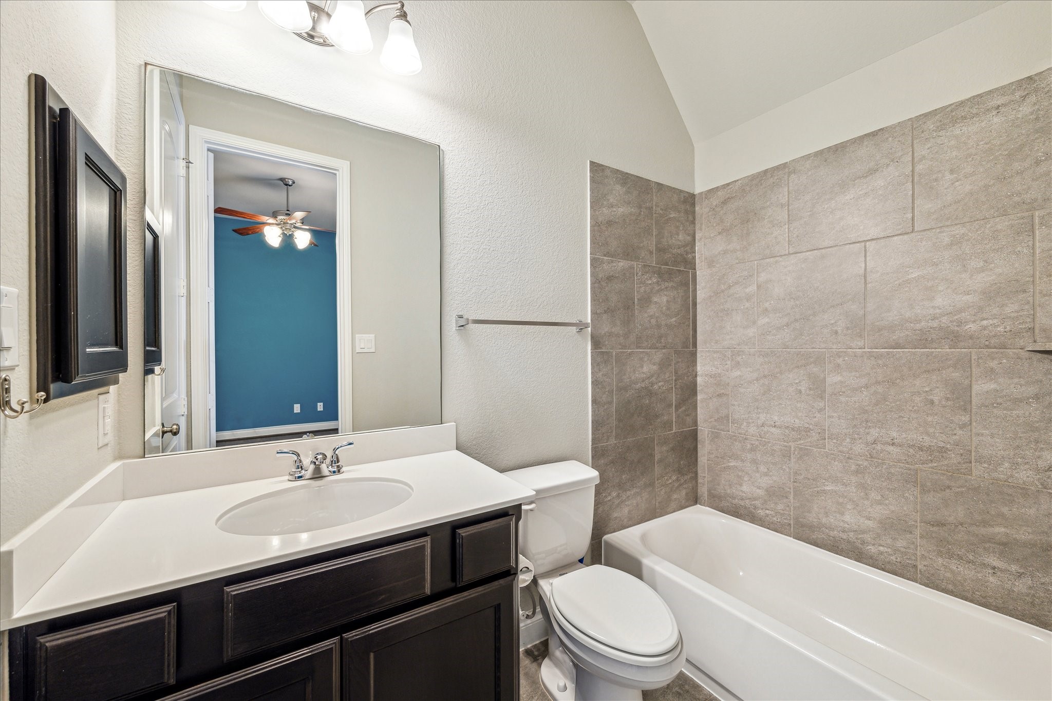 253 Trillium Park Loop Conroe, TX 77304 - Photo 29 of 37 a bathroom with a sink toilet and shower