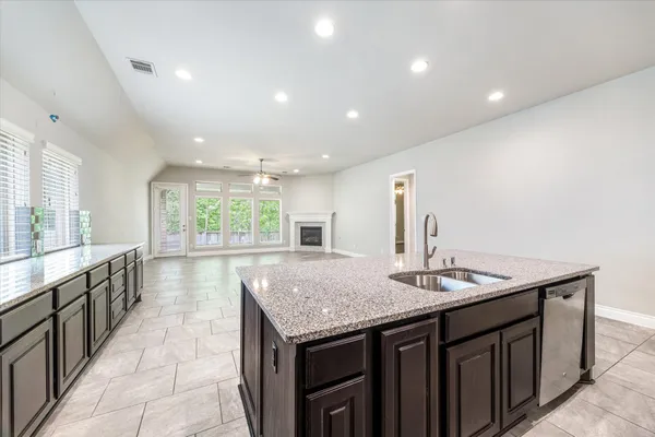 a kitchen with sink and center island