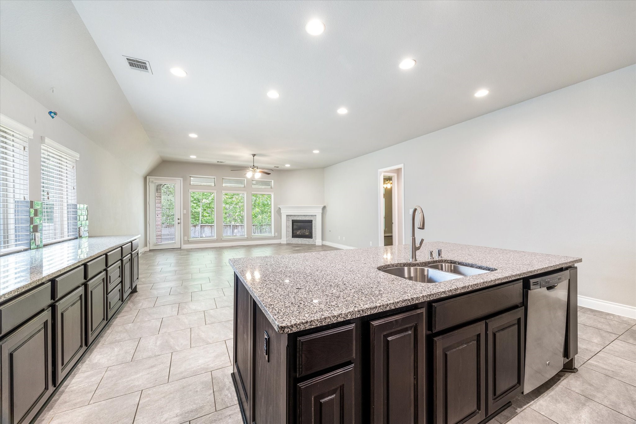 253 Trillium Park Loop Conroe, TX 77304 - Photo 8 of 37 a kitchen with sink and center island