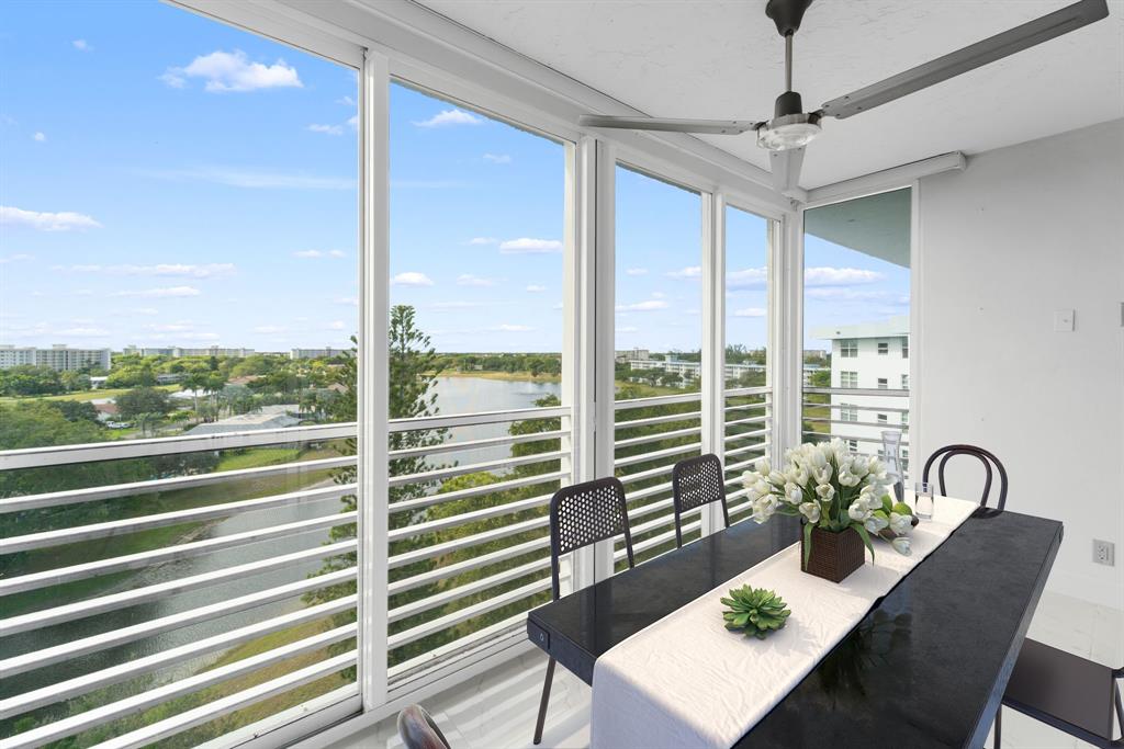 3010 North Course Drive, Unit 911 Pompano Beach, FL 33069 - Photo 3 of 13 a view of a dining room with furniture window and outside view