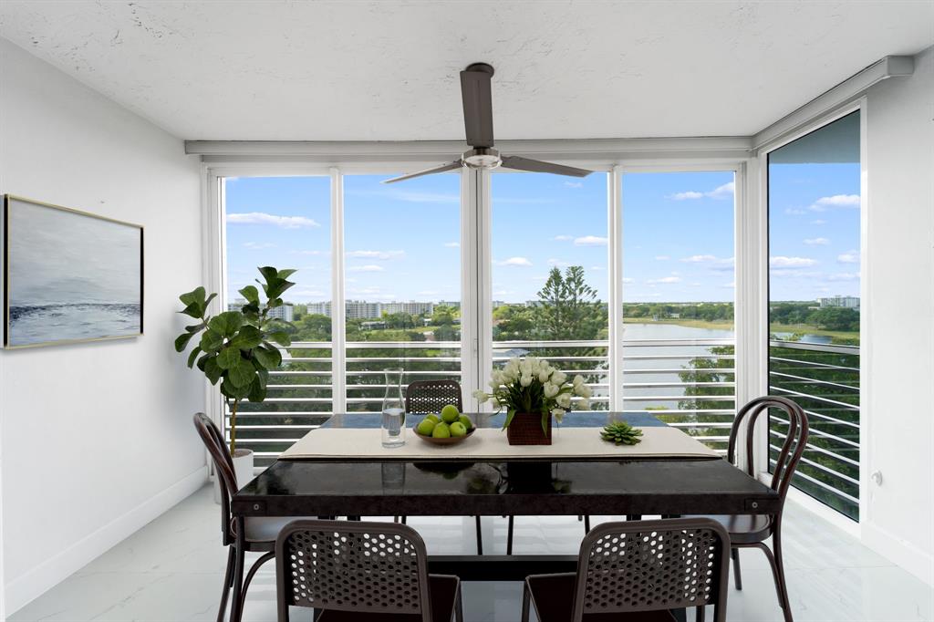 3010 North Course Drive, Unit 911 Pompano Beach, FL 33069 - Photo 4 of 13 a view of a dining room with furniture window and outside view