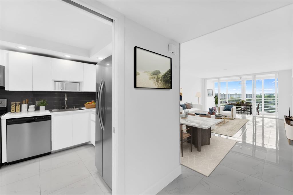 3010 North Course Drive, Unit 911 Pompano Beach, FL 33069 - Photo 5 of 13 a kitchen with a sink and cabinets
