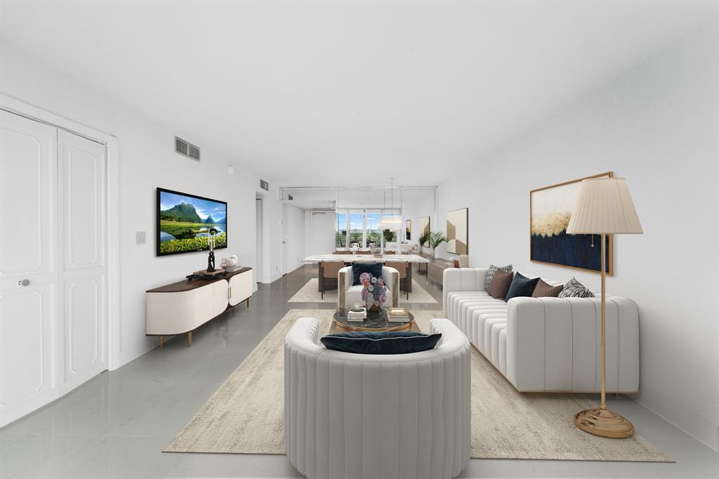 3010 North Course Drive, Unit 911 Pompano Beach, FL 33069 - Photo 7 of 13 a living room with furniture and a flat screen tv