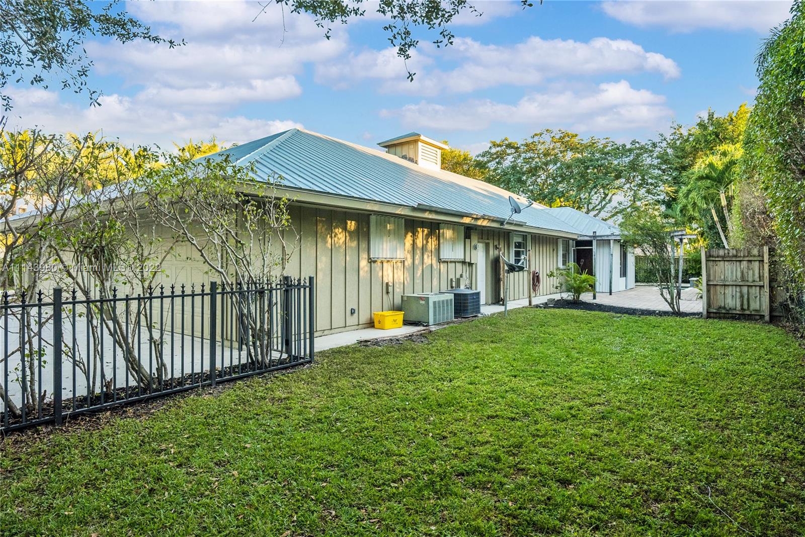 323 Cardinal Avenue Boca Raton, FL 33486 - Photo 50 of 56 a front view of a house with a yard