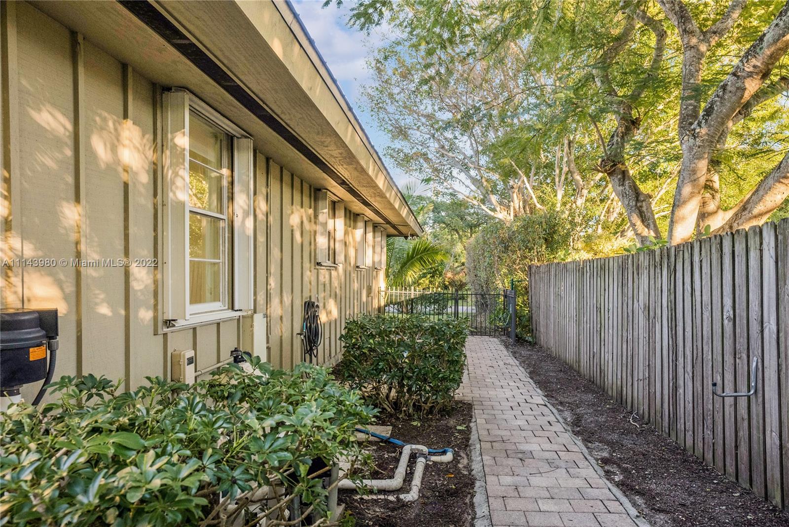 323 Cardinal Avenue Boca Raton, FL 33486 - Photo 54 of 56 a view of a pathway with a garden