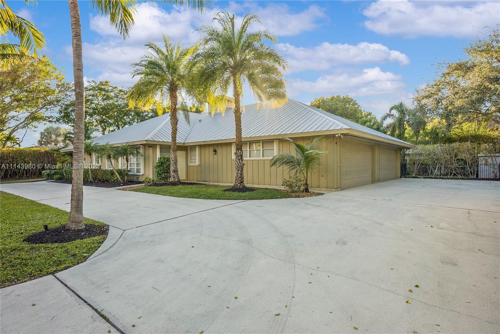 323 Cardinal Avenue Boca Raton, FL 33486 - Photo 7 of 56 a house with palm tree in front of it