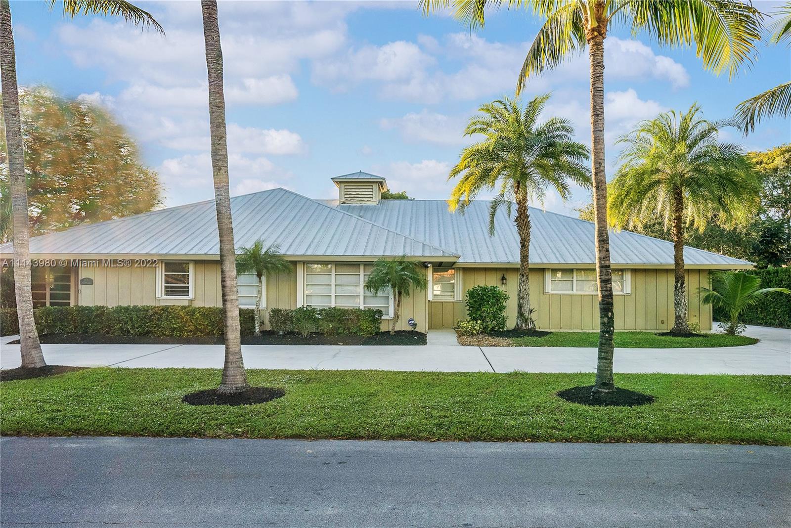 323 Cardinal Avenue Boca Raton, FL 33486 - Photo 8 of 56 a front view of house with yard and green space