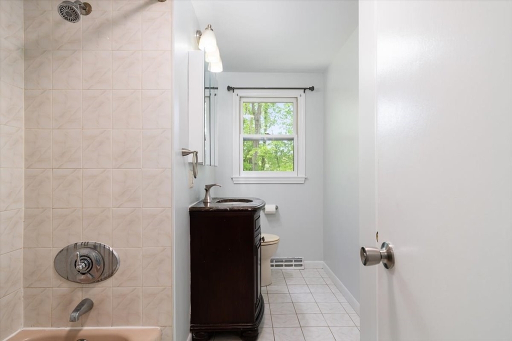 4 Hitchinpost Road Chelmsford, MA 01824 - Photo 14 of 25 a bathroom with a sink and a shower
