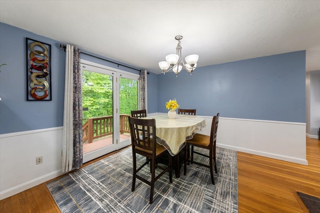 4 Hitchinpost Road Chelmsford, MA 01824 - Photo 10 of 25 a view of a dining room with furniture a rug and wooden floor