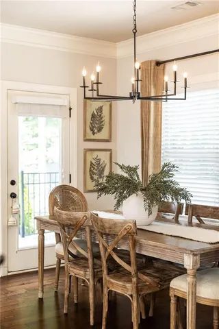 a kitchen with a table and chairs in it