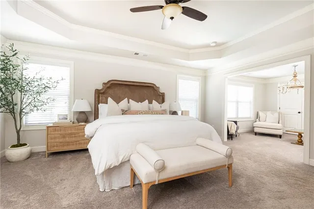 a bedroom with bed and window