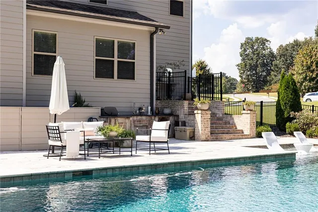 a view of a swimming pool with a patio