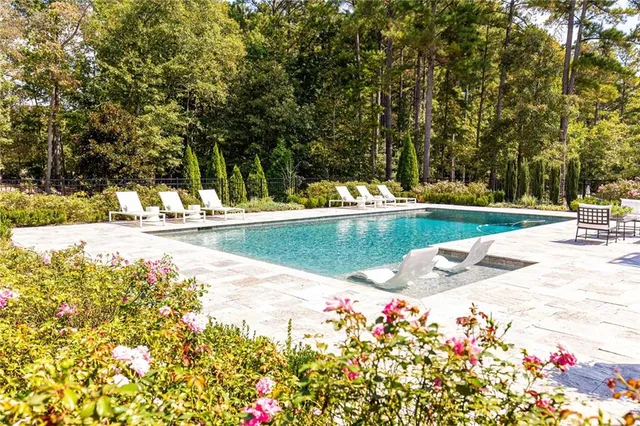 a view of a swimming pool with an outdoor space