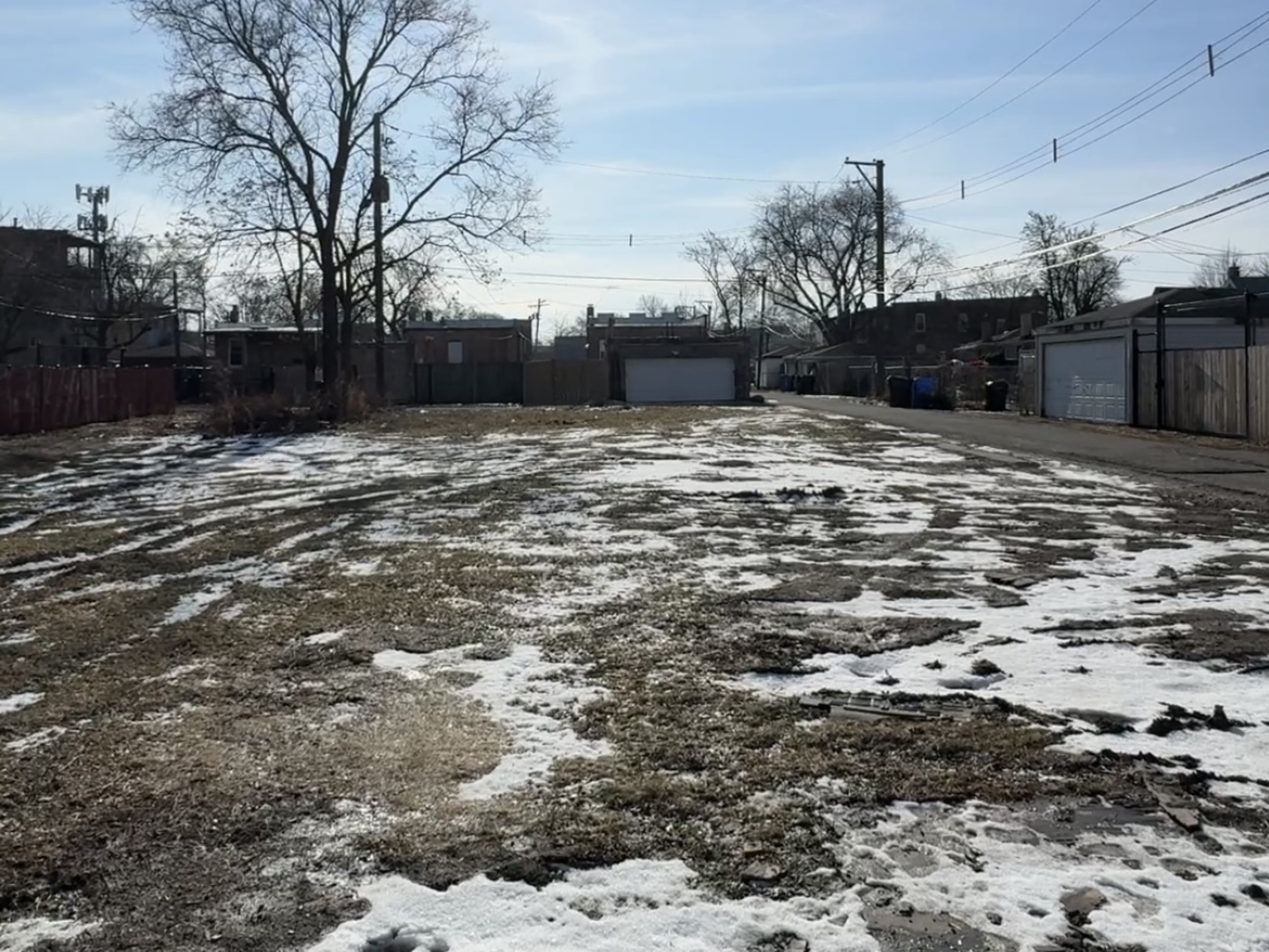3347 West Iowa Street Chicago, IL 60651 - Photo 2 of 2 a street view with wooden fence