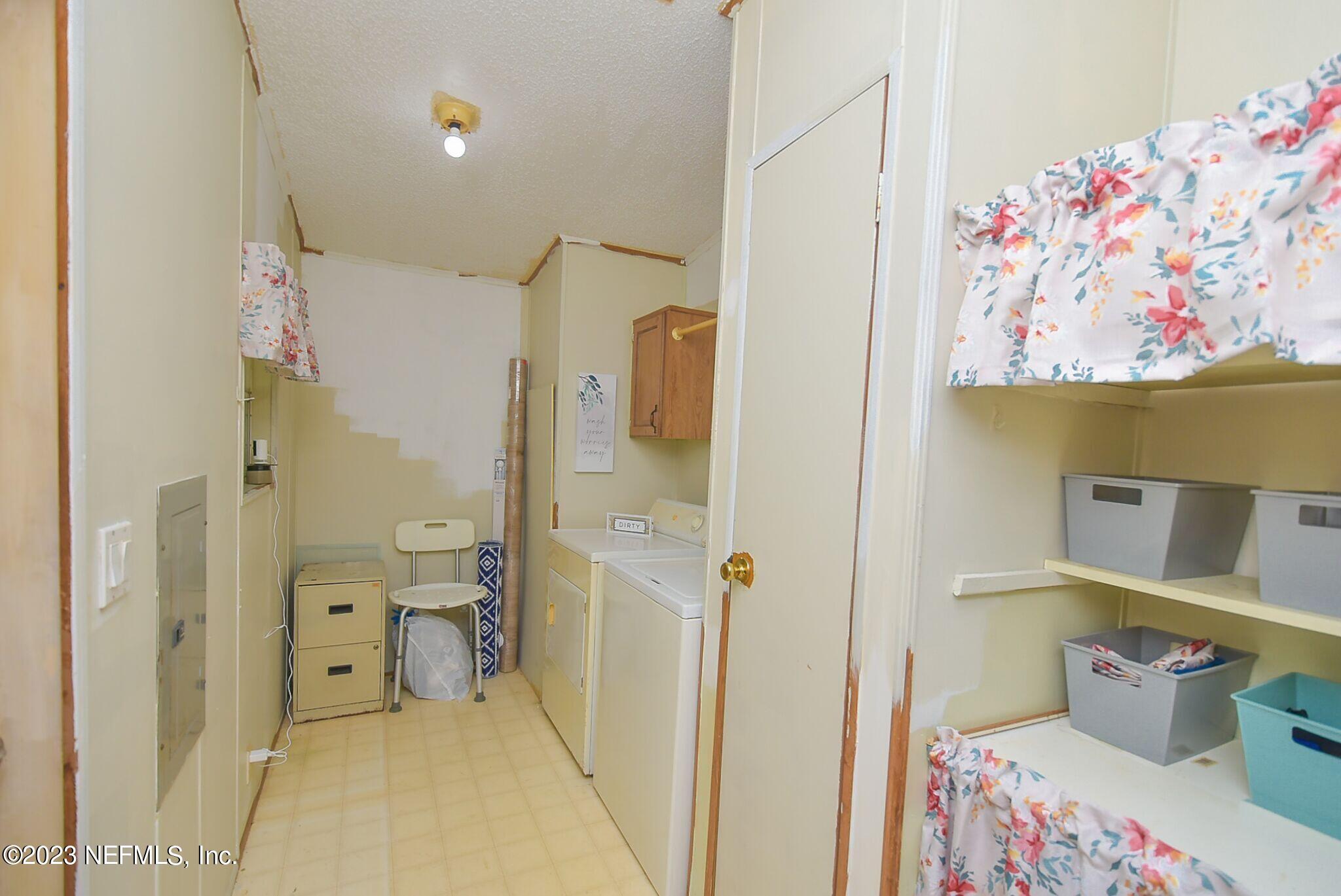 136 Lawrence Lane Georgetown, FL 32139 - Photo 21 of 33 a bathroom with a sink mirror vanity and toilet