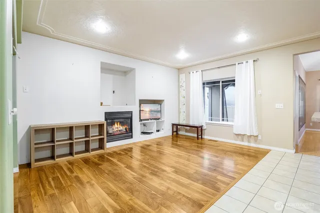 a spacious bedroom with a bed and a fireplace