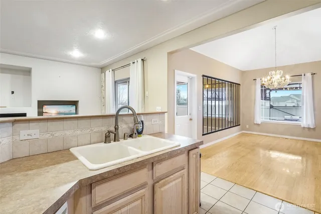 a bathroom with a sink double vanity and a tub
