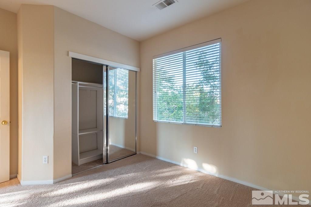 9630 Truckee Meadows Place Reno, NV 89521 - Photo 11 of 18 a view of an empty room with a window
