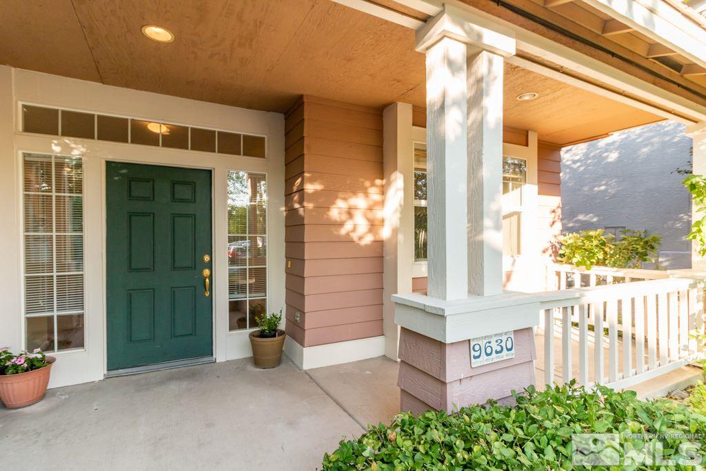 9630 Truckee Meadows Place Reno, NV 89521 - Photo 2 of 18 a front view of a building with potted plants