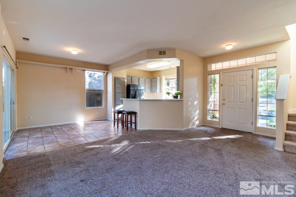 9630 Truckee Meadows Place Reno, NV 89521 - Photo 3 of 18 a view of a livingroom with furniture and a window