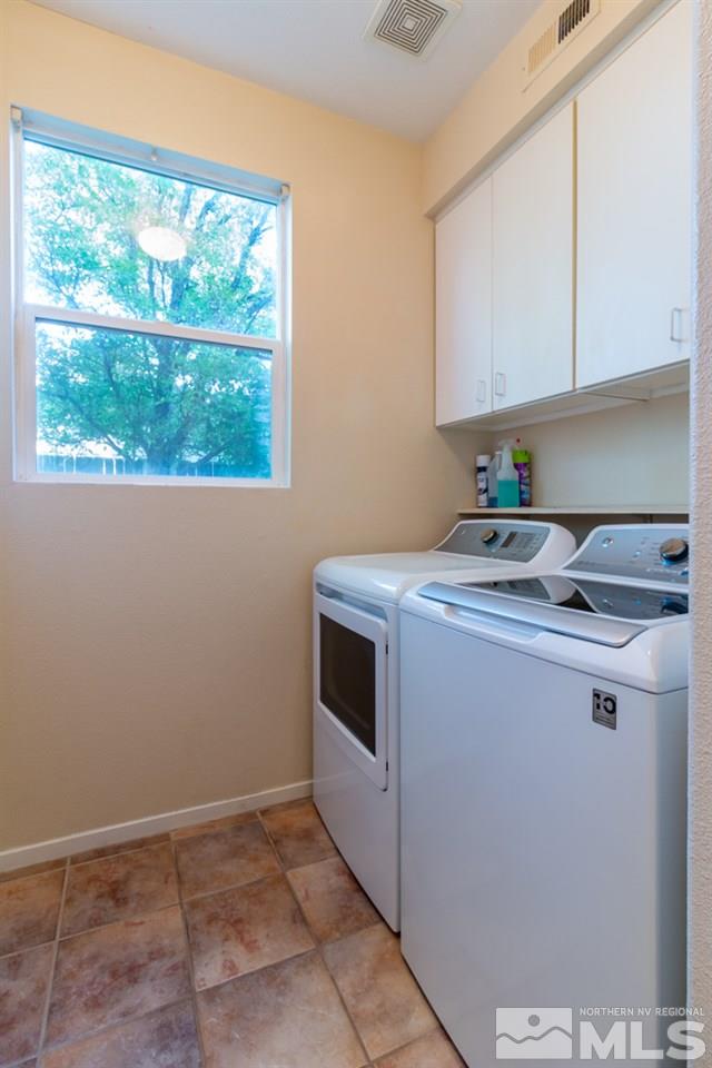 9630 Truckee Meadows Place Reno, NV 89521 - Photo 5 of 18 a utility room with washer and dryer