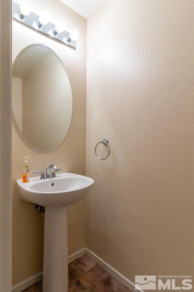 9630 Truckee Meadows Place Reno, NV 89521 - Photo 6 of 18 a bathroom with a sink and mirror