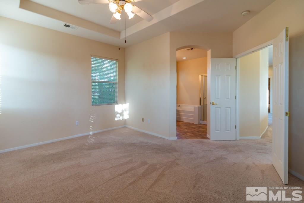 9630 Truckee Meadows Place Reno, NV 89521 - Photo 8 of 18 an empty room with windows and entrance